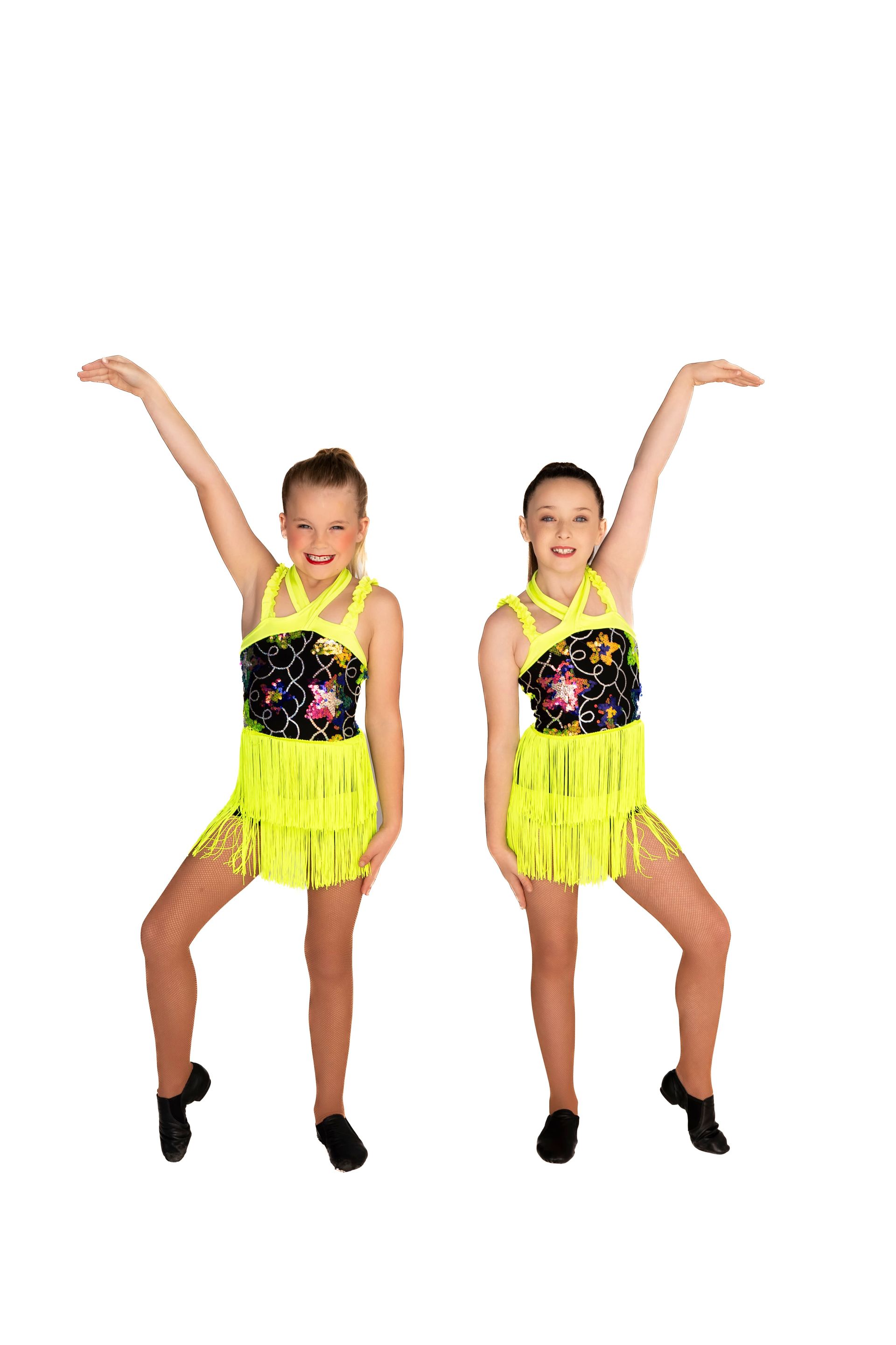 Two dancers in neon yellow fringe dresses with arms raised — iDance Performance Co In Medowie, NSW