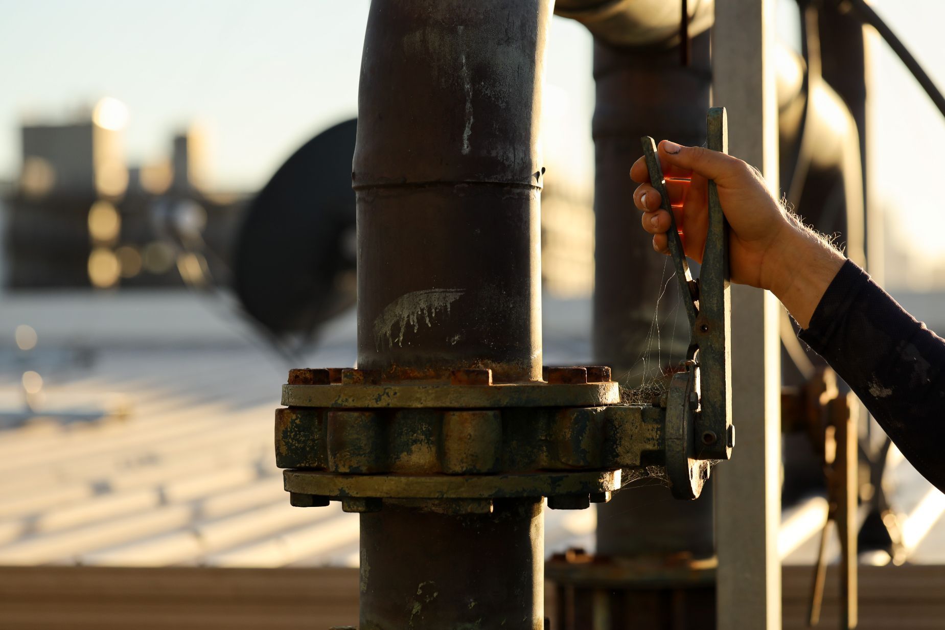 Hand Turning on Main Water Supply Valve — Plumbers in Yeppoon, QLD