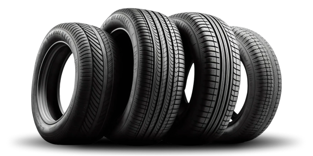 Four black car tires lined up against a white background. | Tires On Location