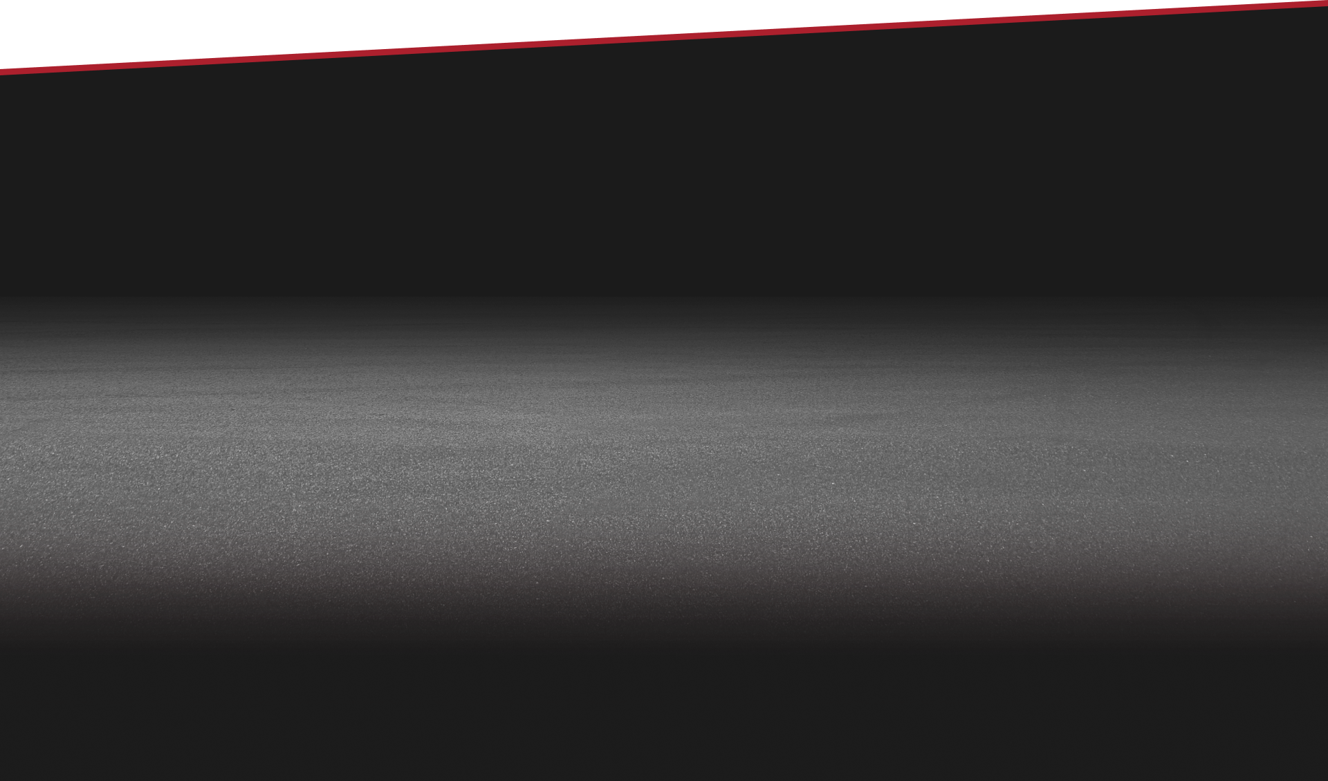 Gray and black gradient background, with a red line at the top. | Tires On Location