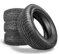 Four black winter tires, three stacked, one leaning. | Tires On Location