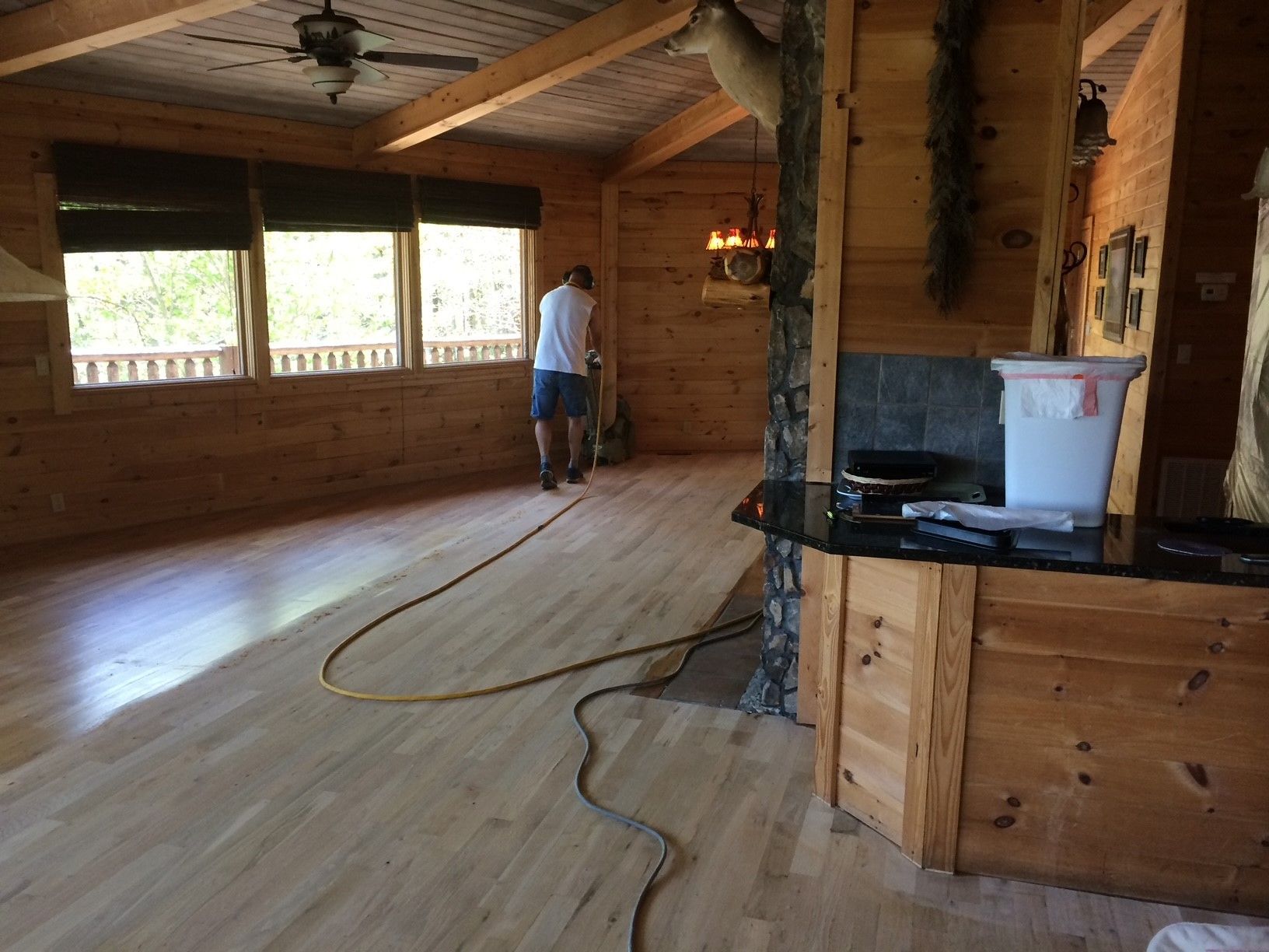 Man Fixing Floor — Rutledge, TN — A & B Hardwood Flooring