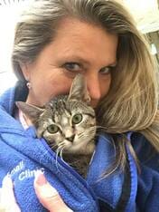 Woman Cuddles Cat — Animal Clinic in Mobile, AL