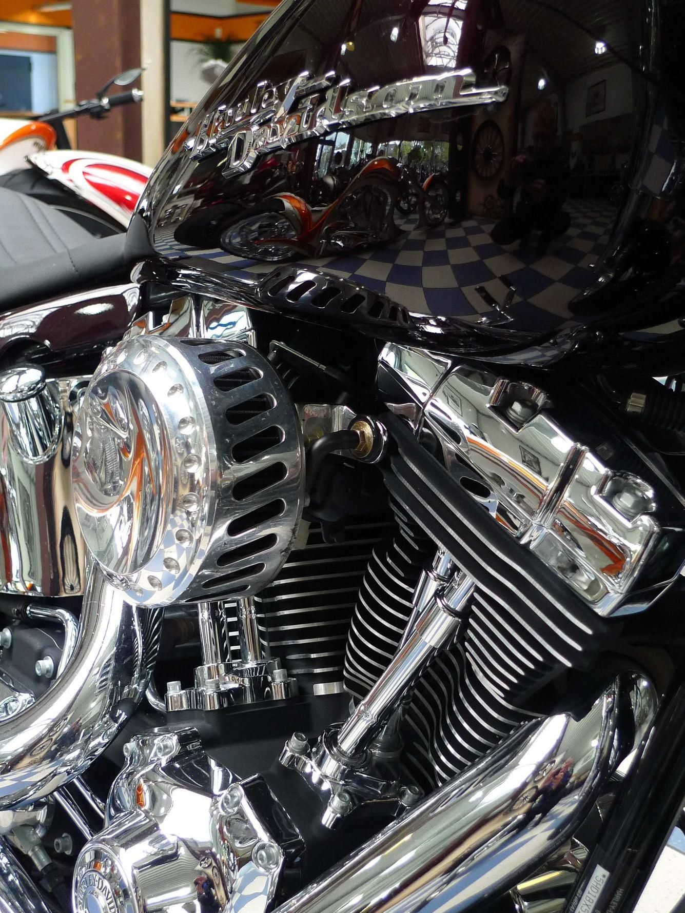 A close up of a harley davidson motorcycle engine