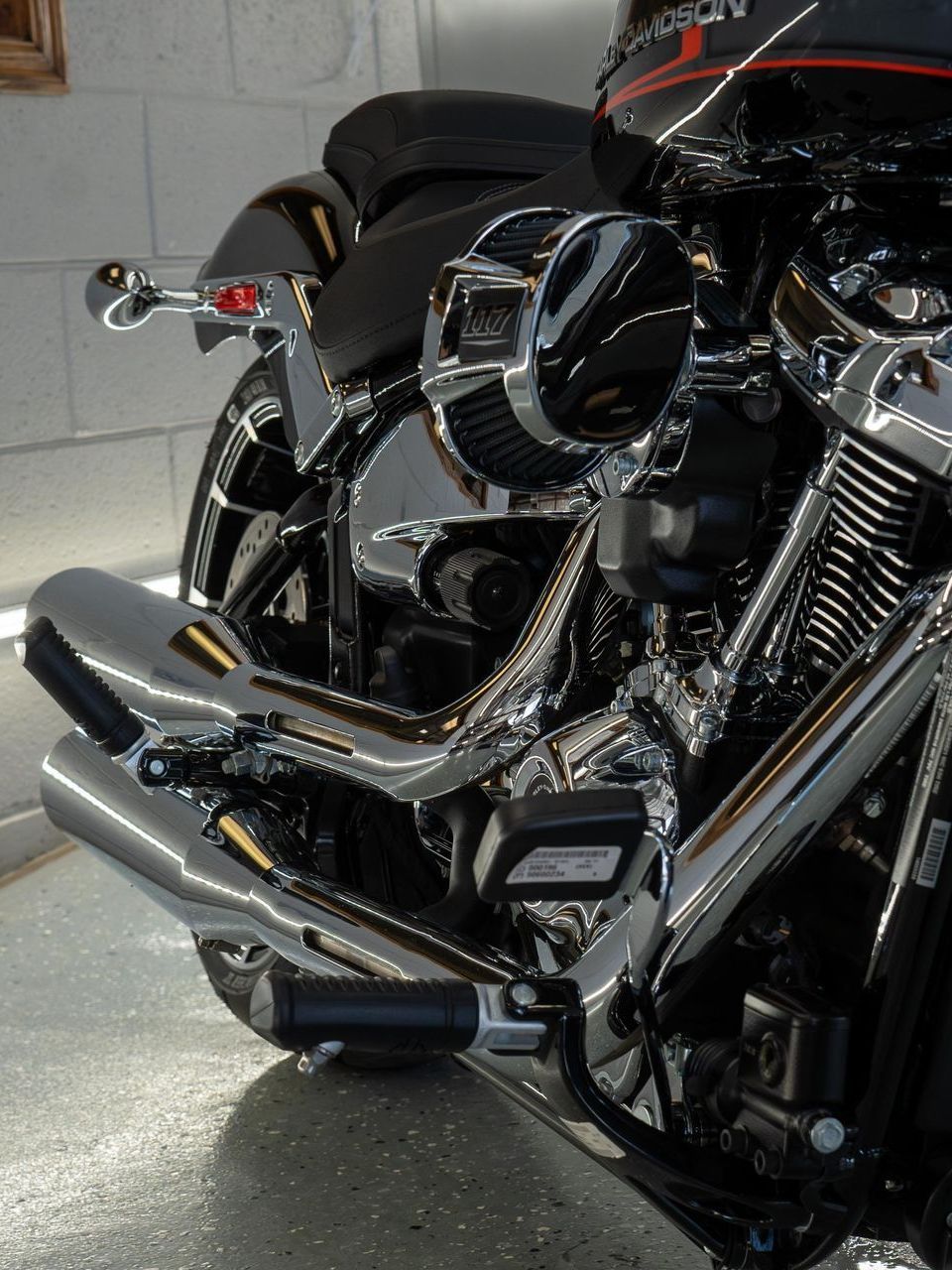 A harley davidson motorcycle is parked in a garage