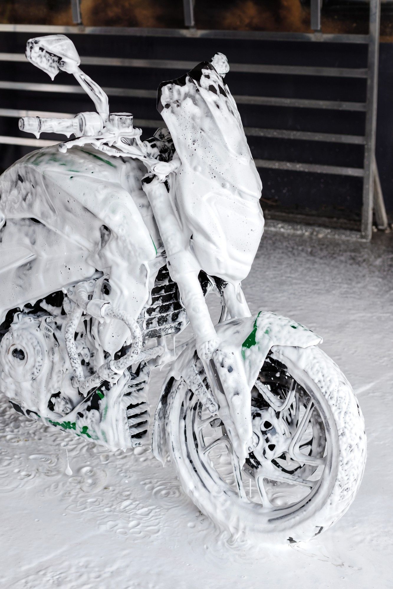 A motorcycle is covered in white foam.