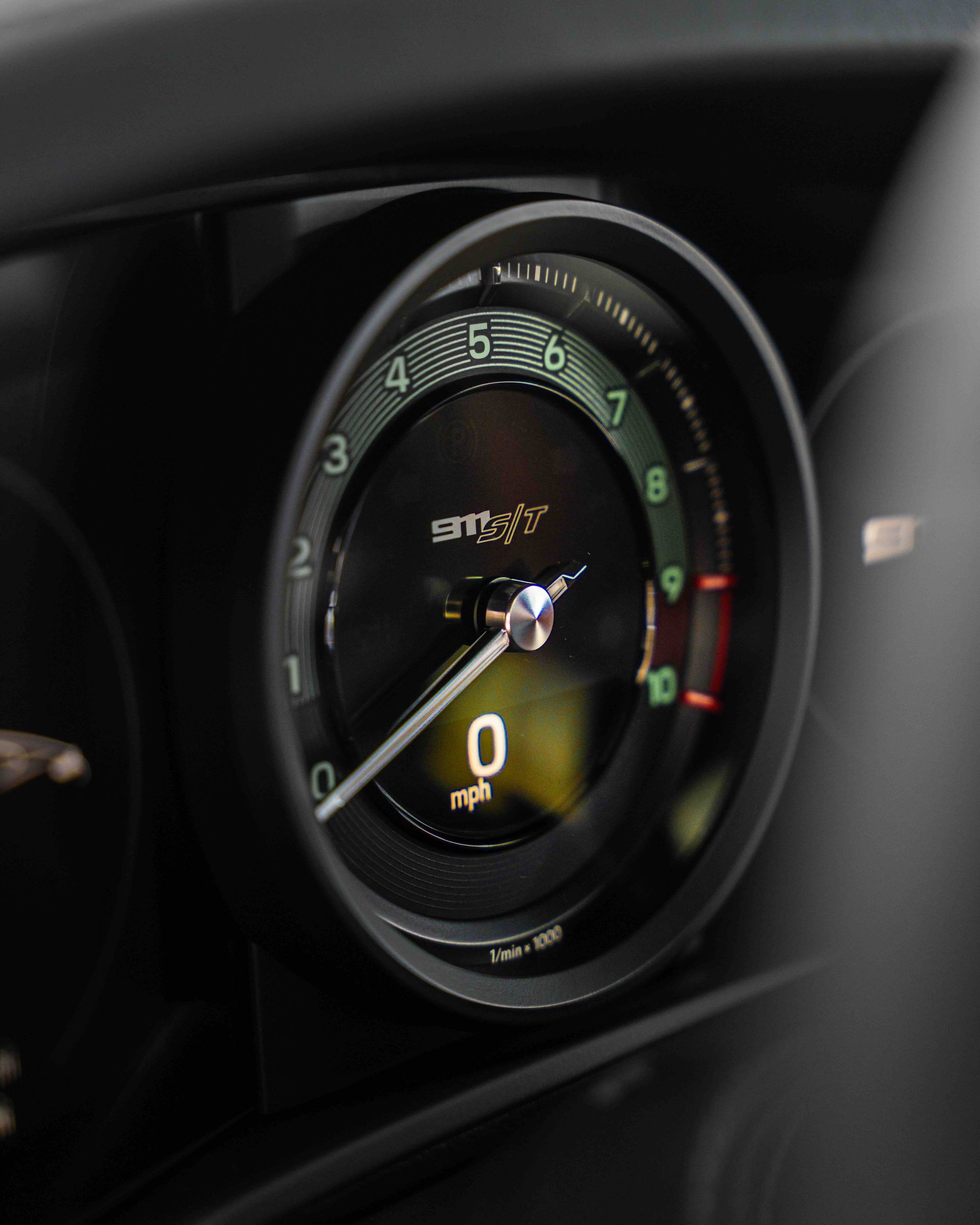 A close up of a speedometer in a car