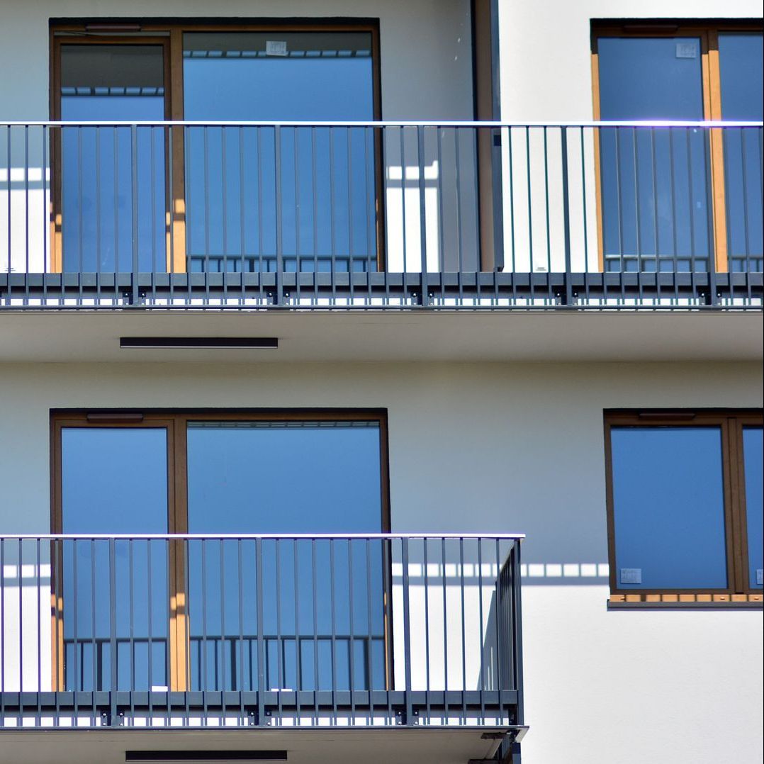 A building with a lot of windows and balconies