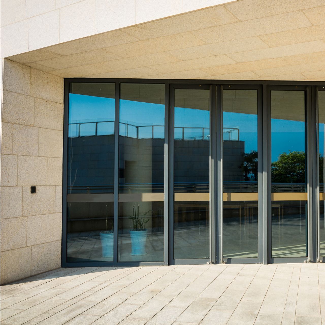 A large building with a lot of glass doors