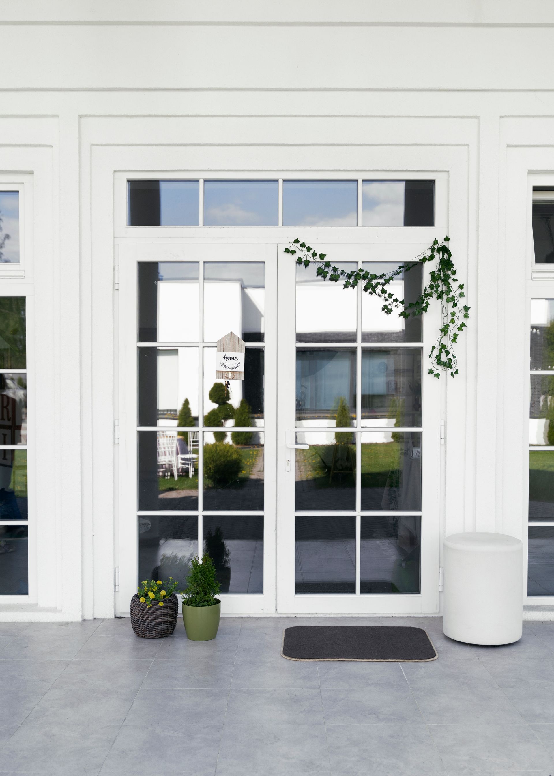 A white house with a sliding glass door