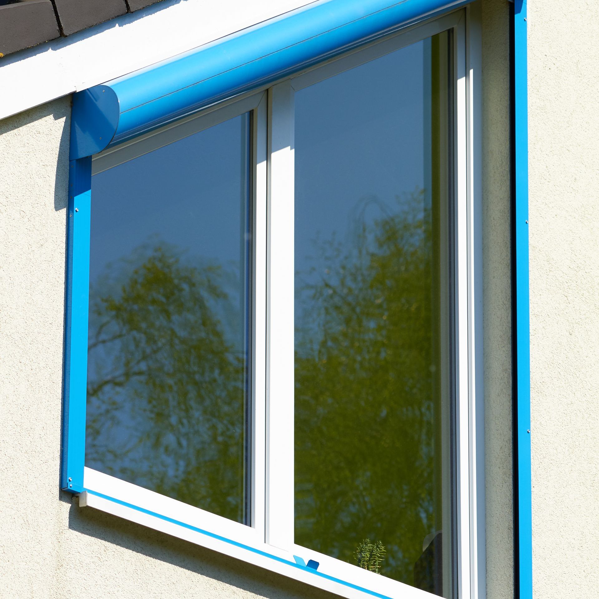 A white window with a blue trim on it