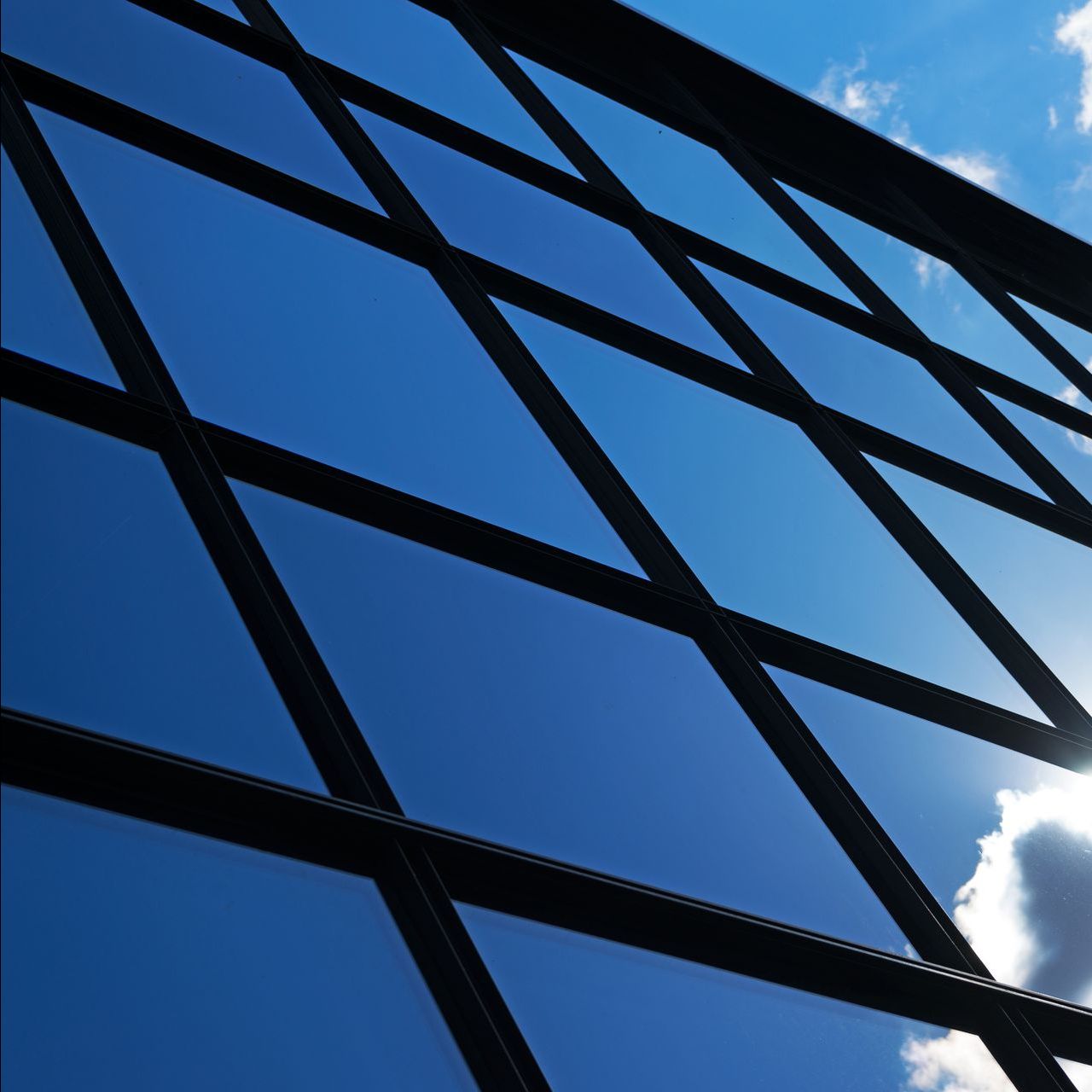 Looking up at a building with a blue sky behind it