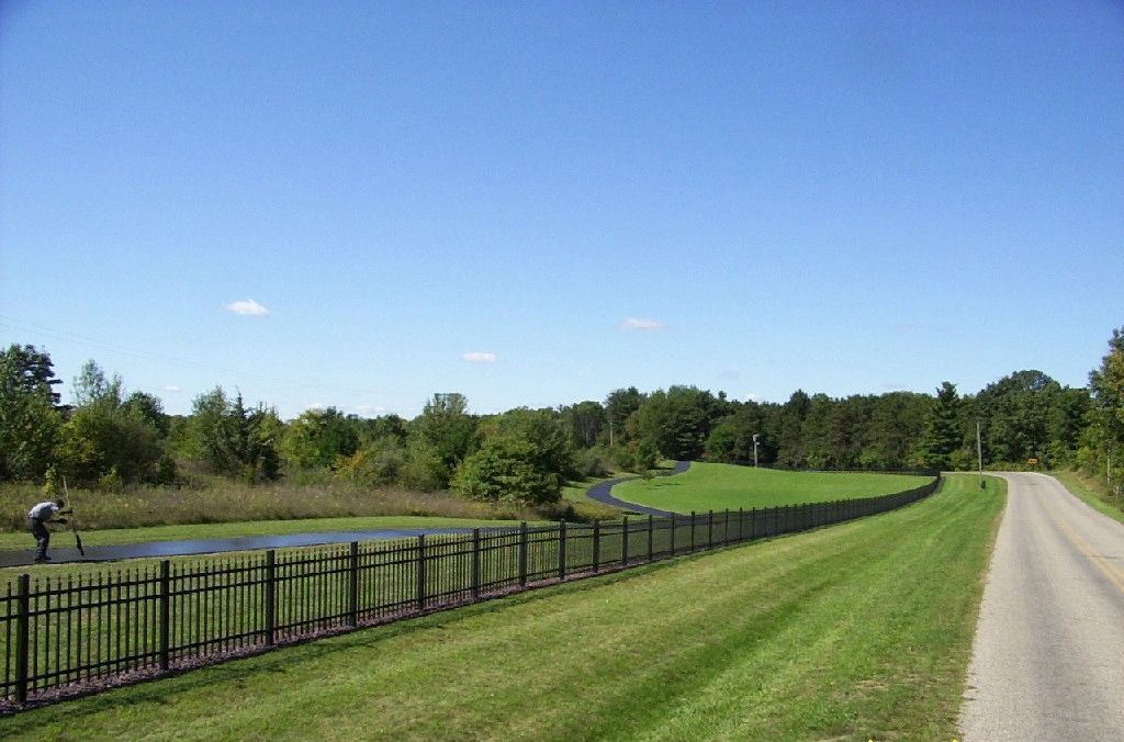 Man Putting Asphalt on the Road — Battle Creek, MI — Damron Brother’s Asphalt