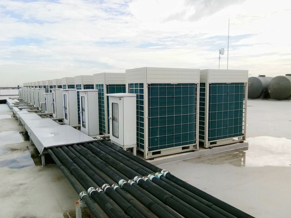 Central Sir Conditioners Condenser Units At Building Rooftop — Oriel Refrigeration and Air Conditioning in Dubbo, NSW