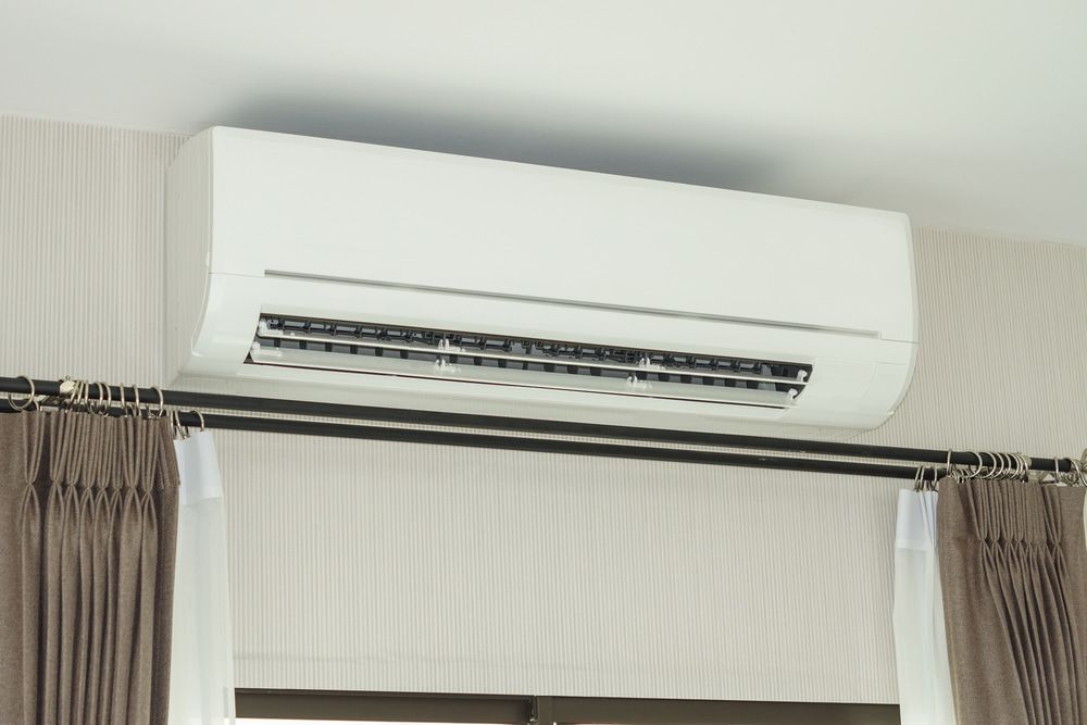 Air Conditioner Installed On The Wall Under The Ceiling — Oriel Refrigeration and Air Conditioning in Nyngan, NSW