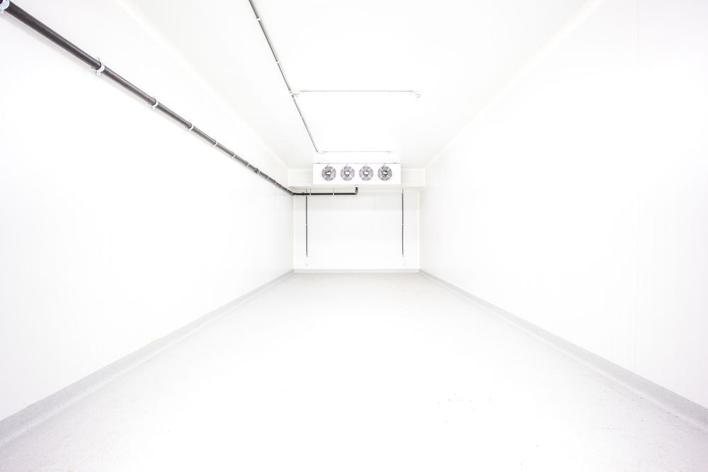 Empty Industrial Room Refrigerator With Four Fans — Oriel Refrigeration and Air Conditioning in Dubbo, NSW