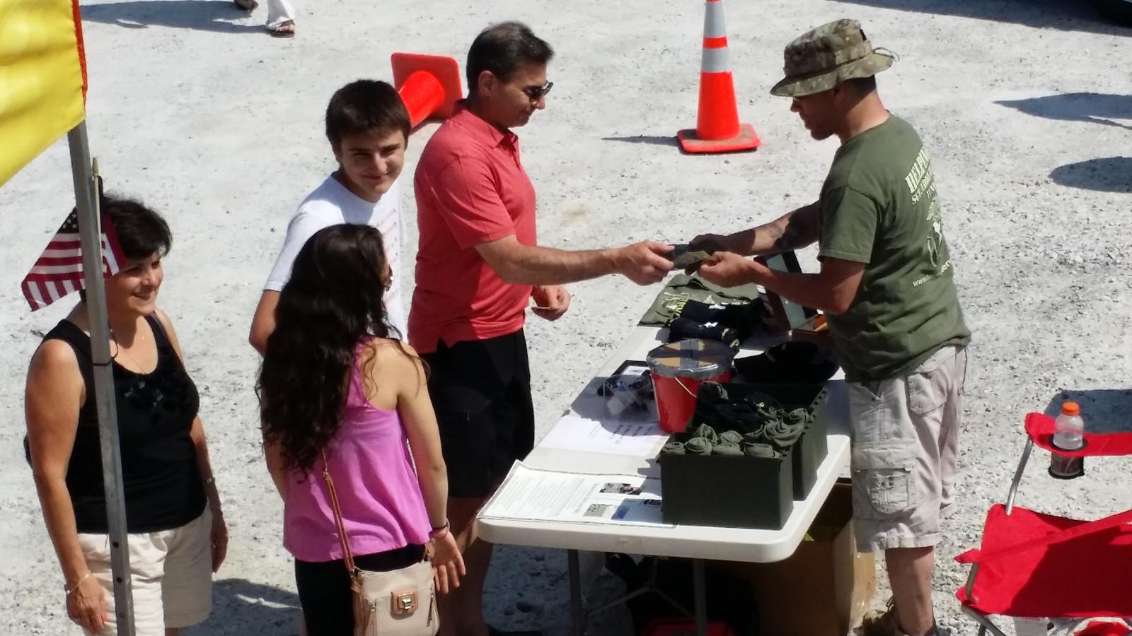 Family Talking to Military Volunteer — Mahopac, NY — Mahopac Marina