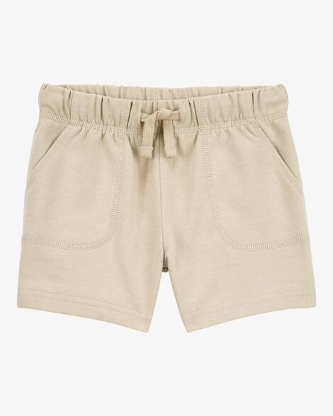 Shorts beige con cinturilla elástica, cordón y dos bolsillos delanteros.