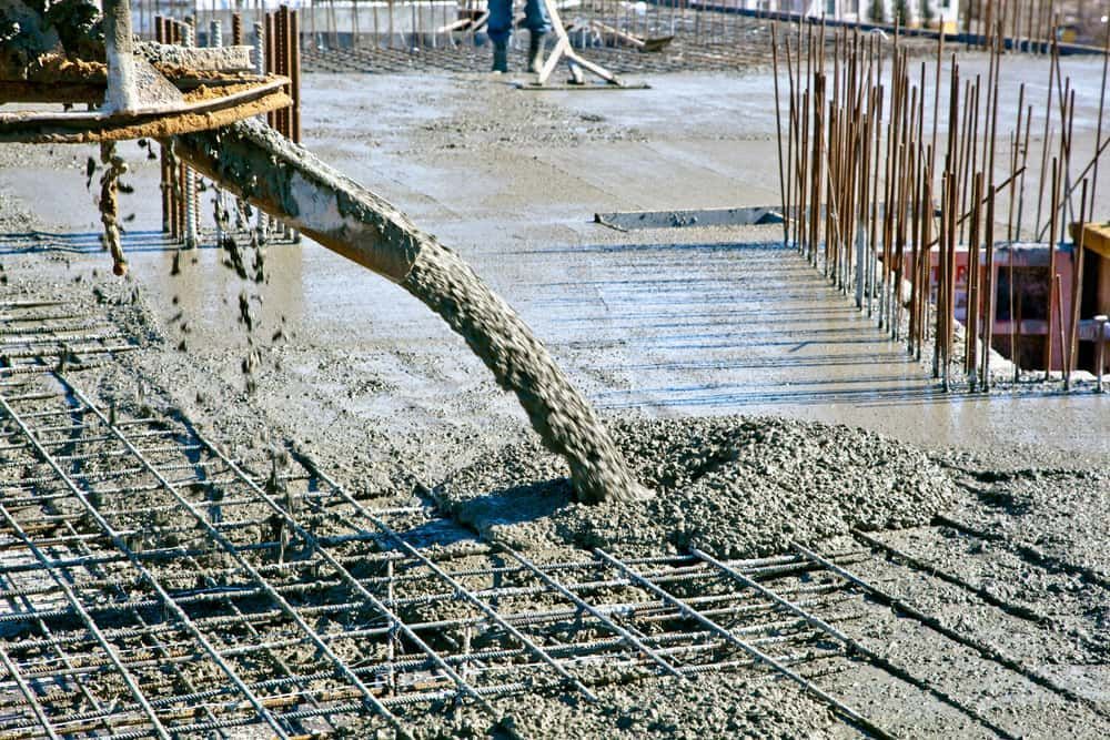A Concrete Pump is Pouring Concrete on a Construction Site — Kontek Constructions in Jimboomba, QLD