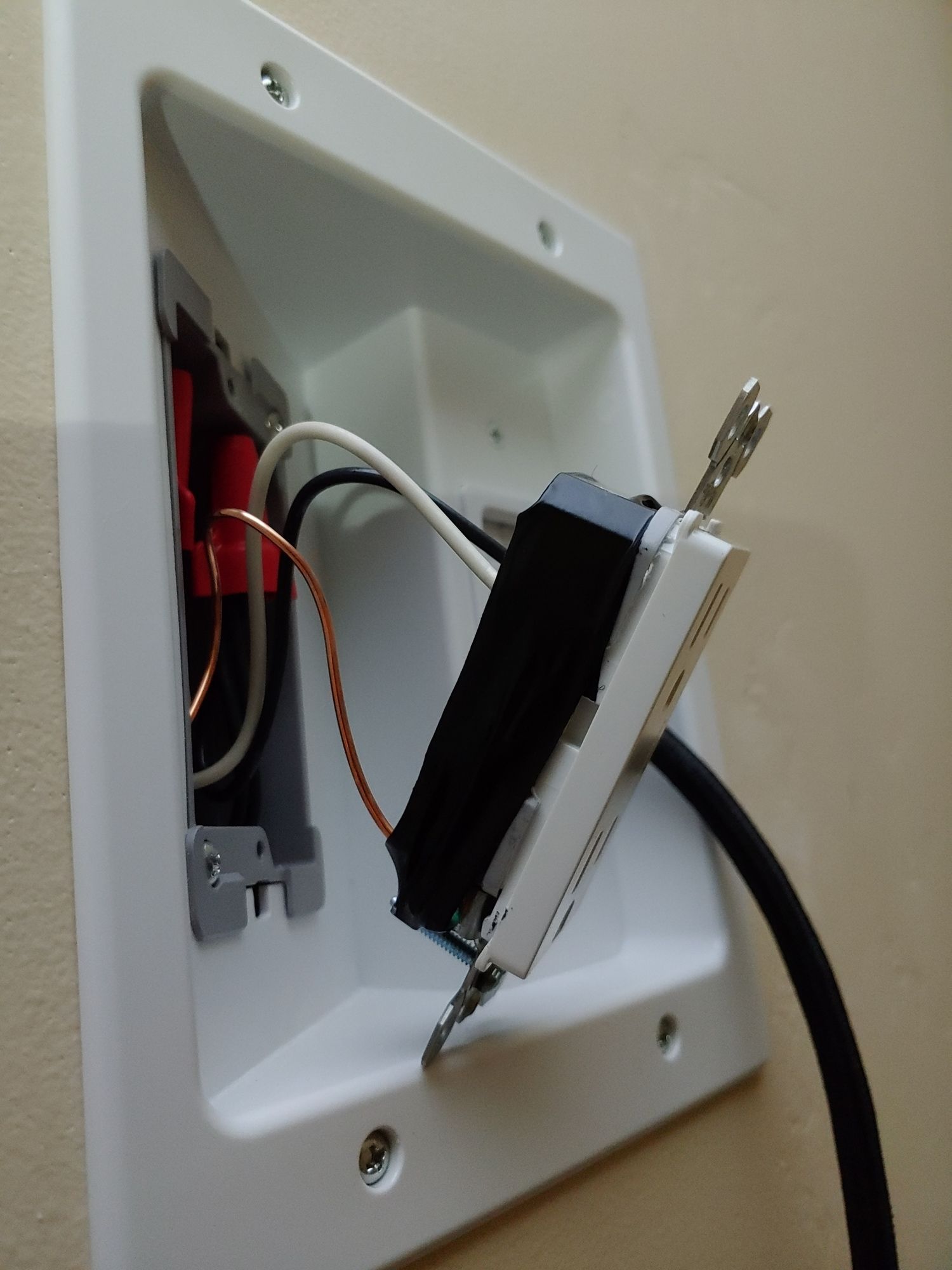 A white box with wires coming out of it