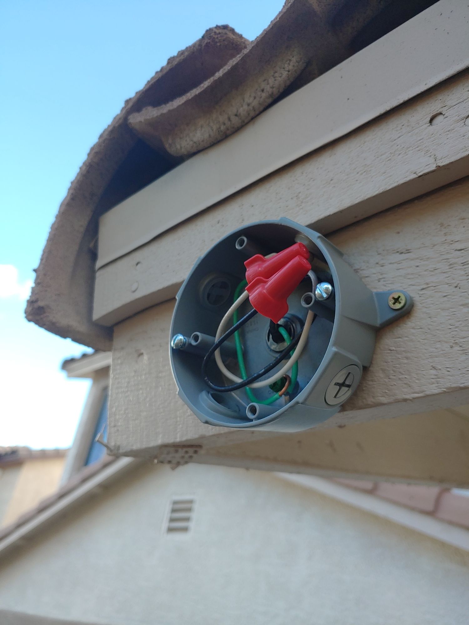 A gray box with a red wire coming out of it