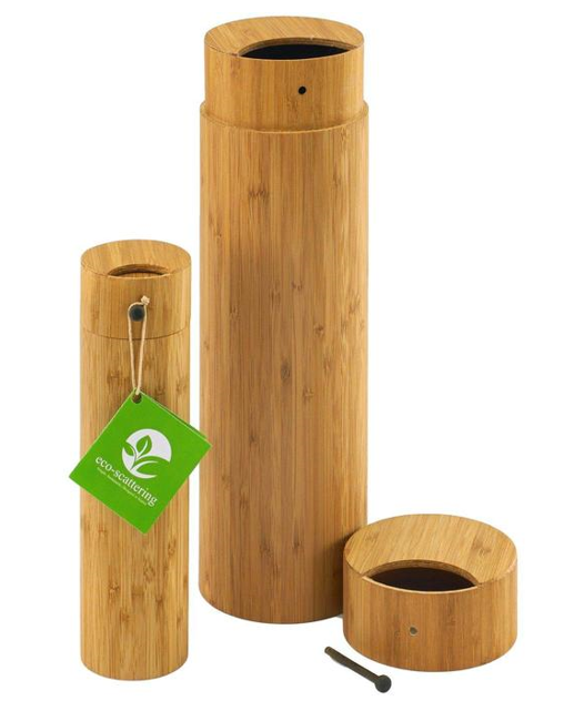 Three wooden cylinders with a green tag that says eco-friendly