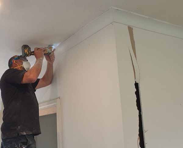 An illustration of a house with a red roof