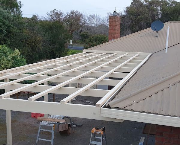 A wooden table with a lot of tools on it.