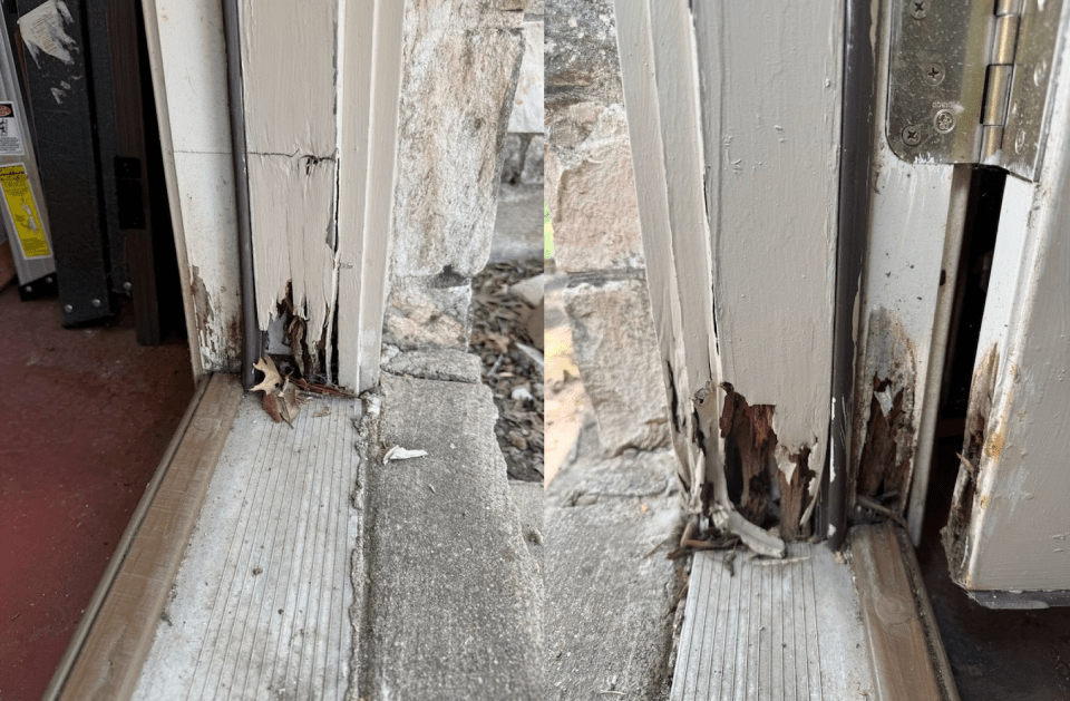 Damaged wooden door frame with significant rot and crumbling structure.