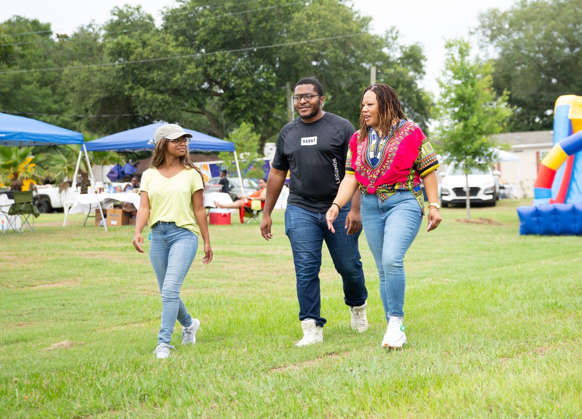 a group of three friends out for a walk in the park