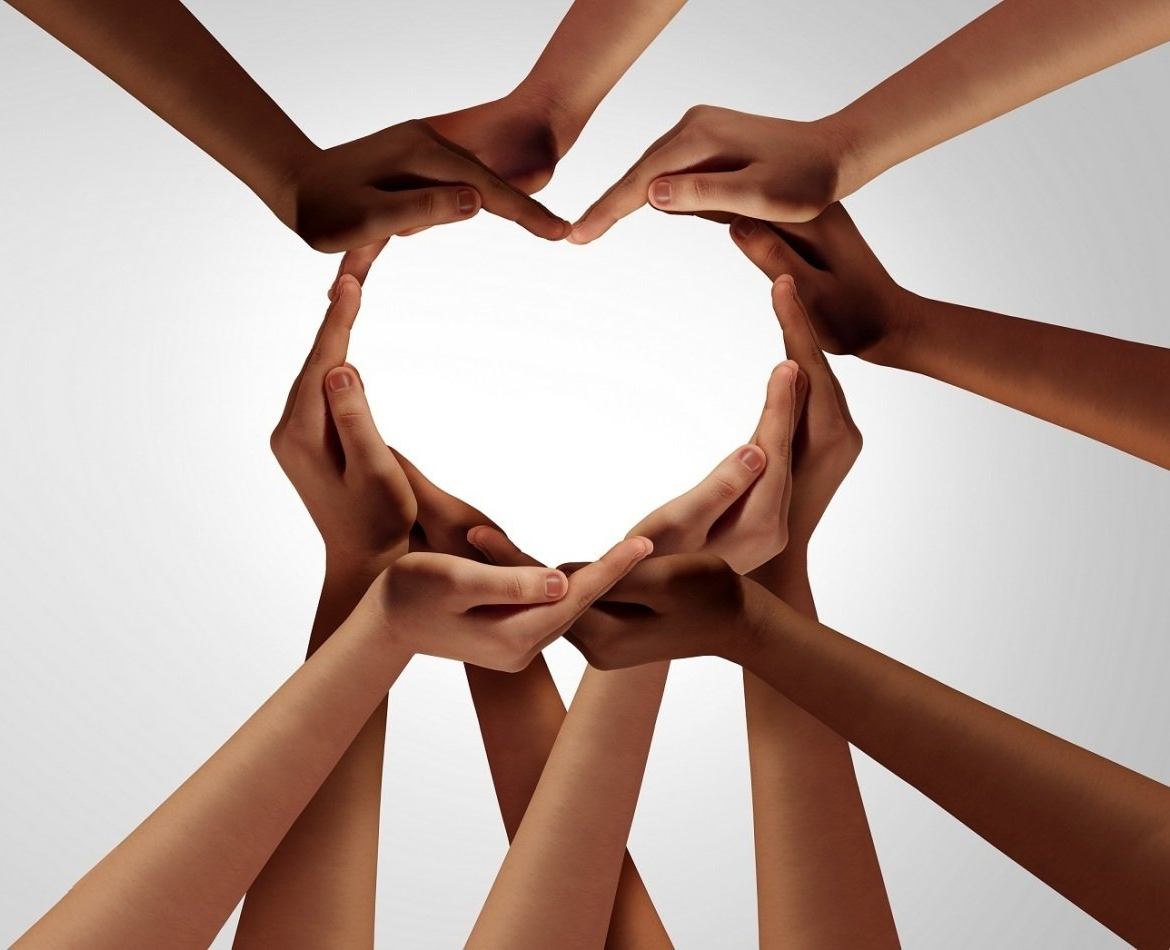 many hands making a heart together