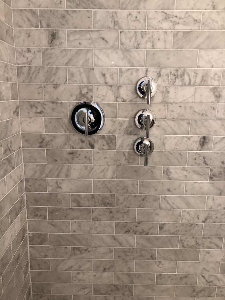 A person is pressing a button on a washing machine.