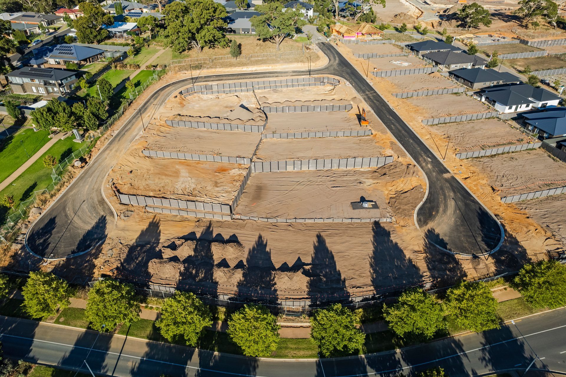 An aerial view of a residential area with lots of trees and houses.