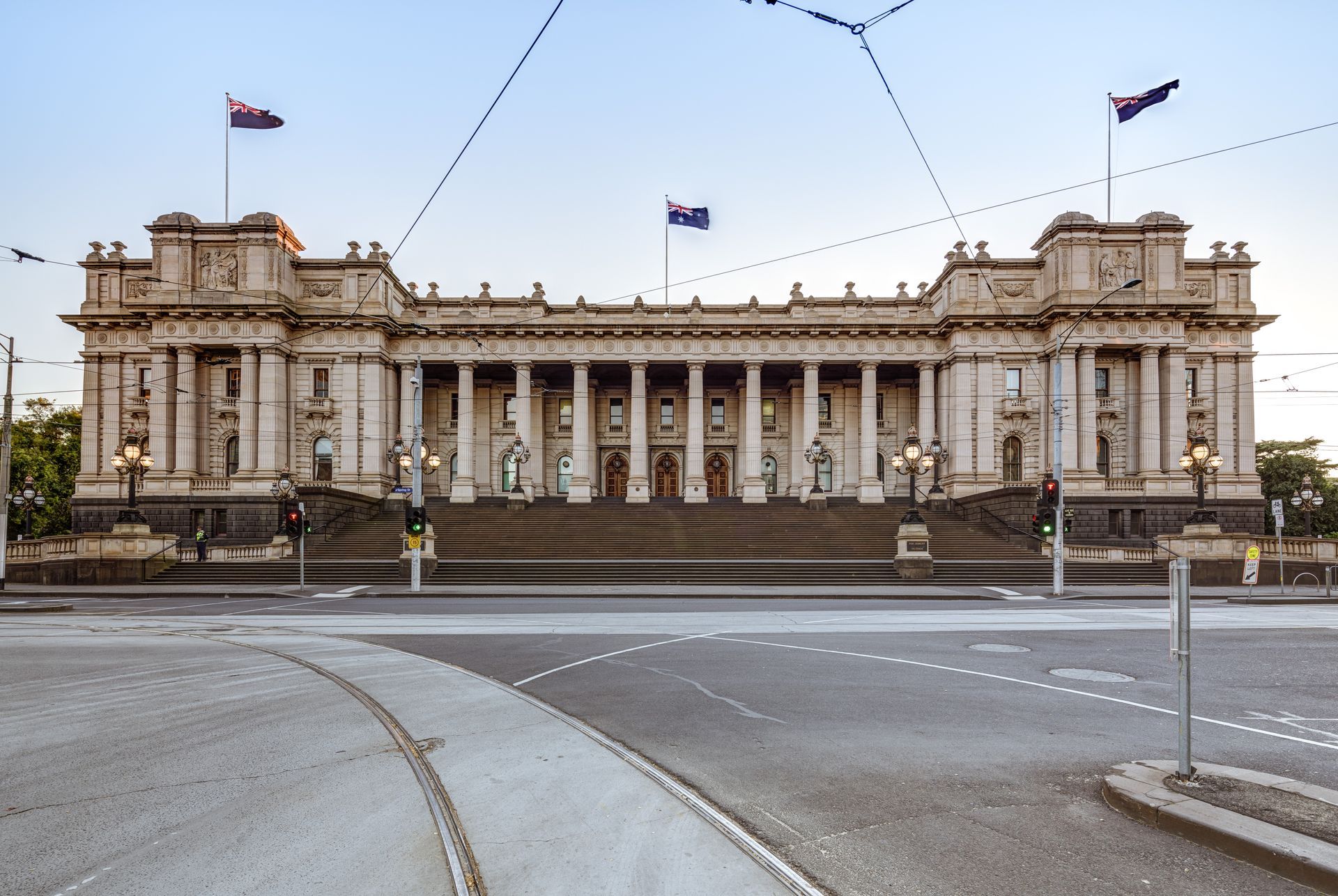 A large white building with a flag on top of it