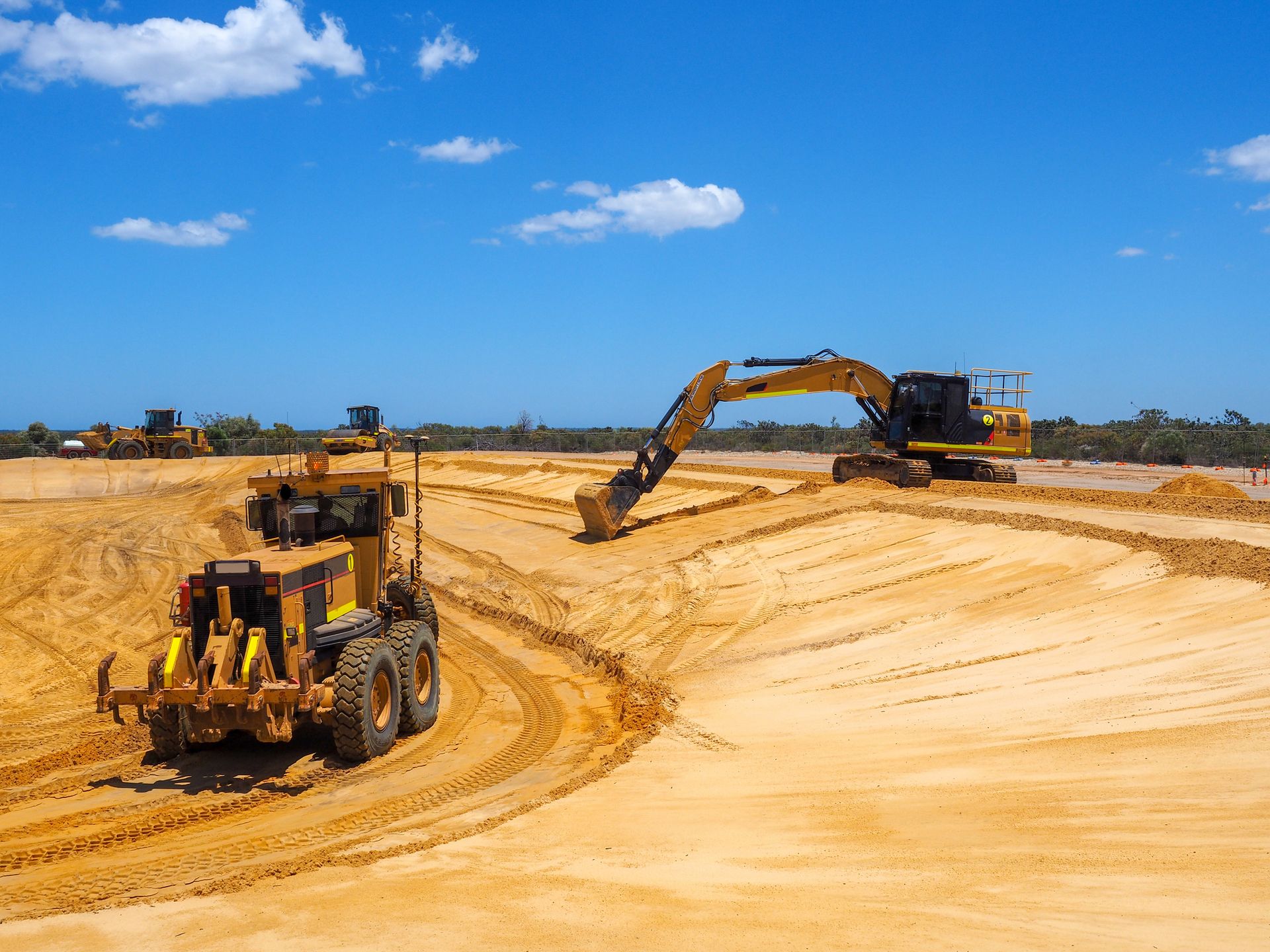 A bulldozer is moving dirt on a construction site.