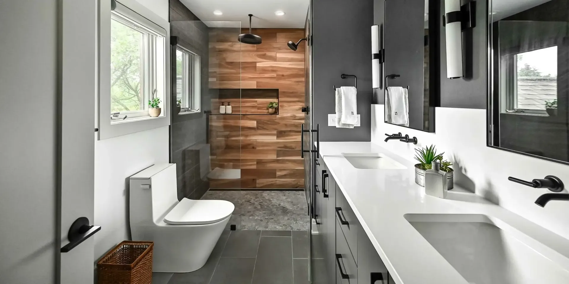 Modern bathroom with a wood-paneled shower, gray walls, and a white double vanity.