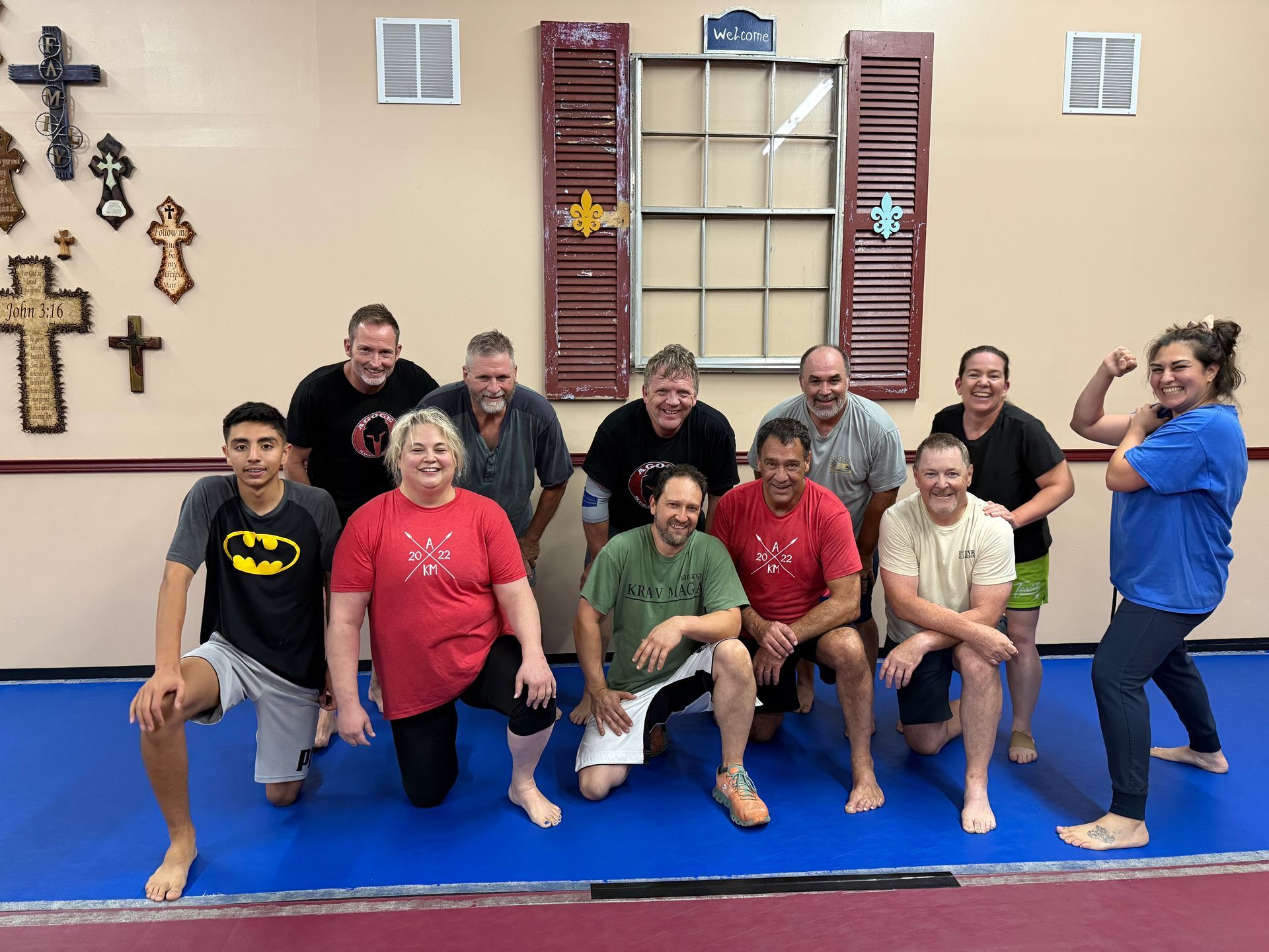 Family practicing self-defense drills at Agoge Krav Maga in Lindale, TX.