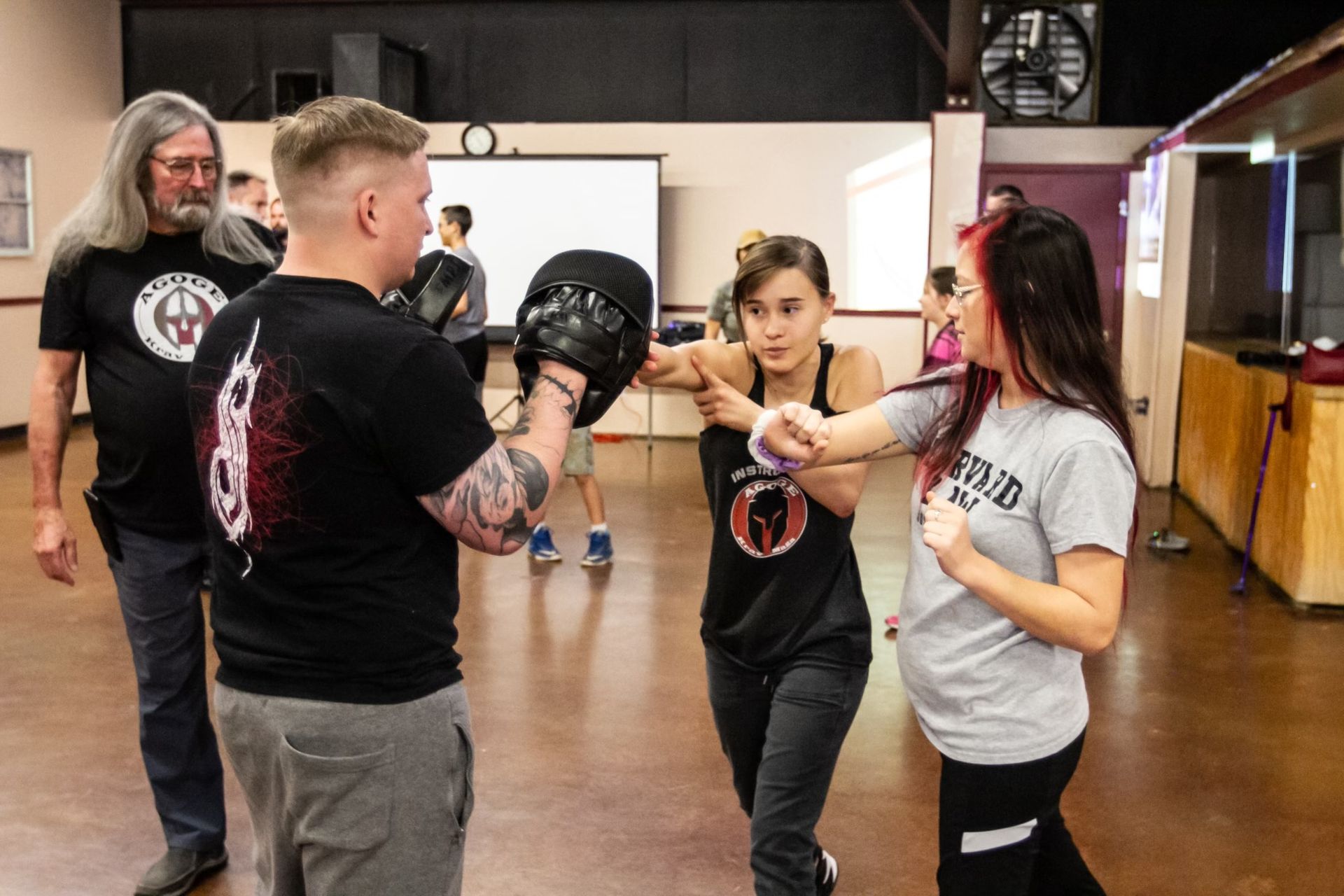 Students practicing practical self-defense drills at Agoge Krav Maga in Lindale, TX.