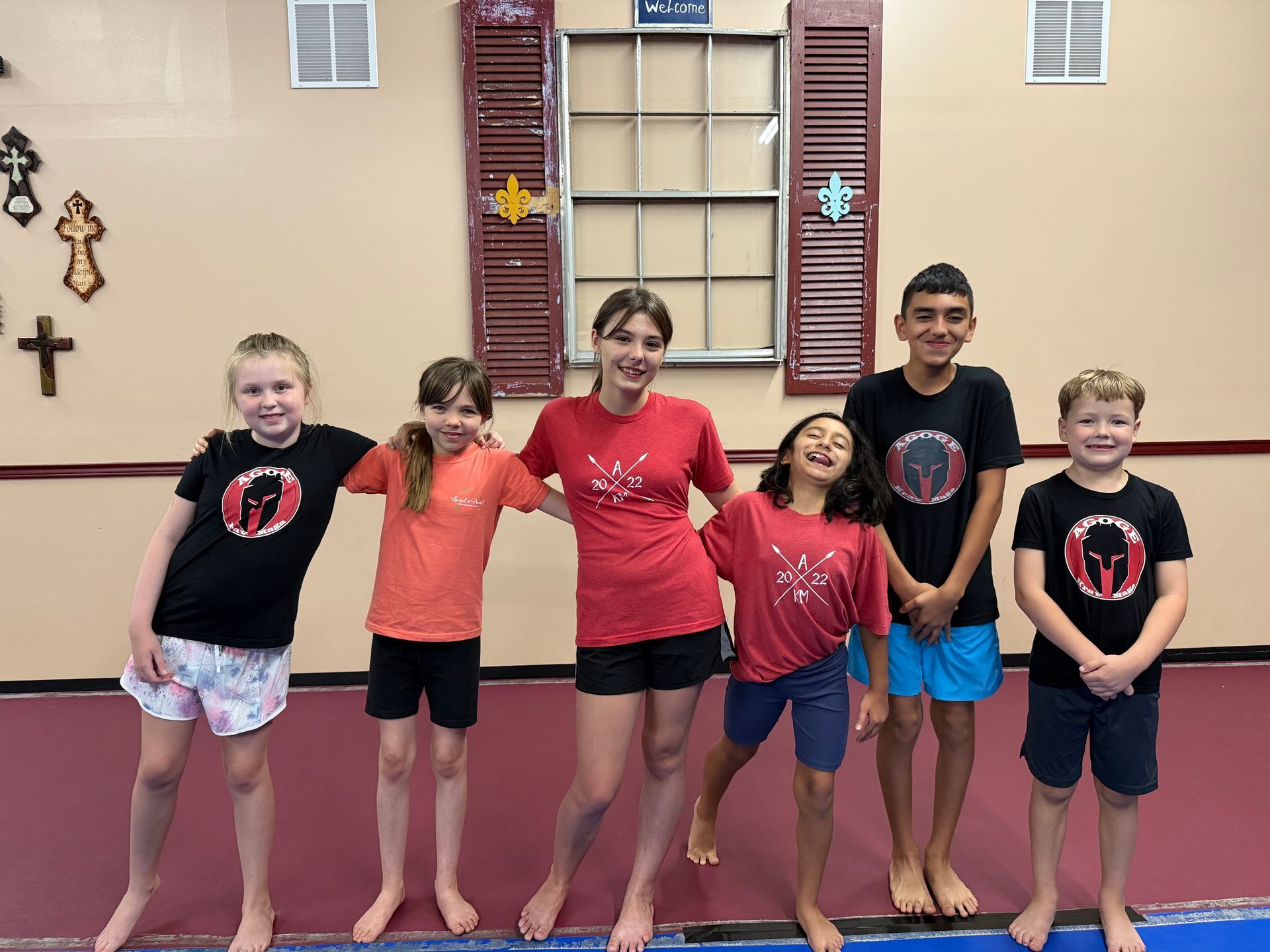 Teens practice partner self-defense drills at Agoge Krav Maga in Lindale, TX, building confidence.