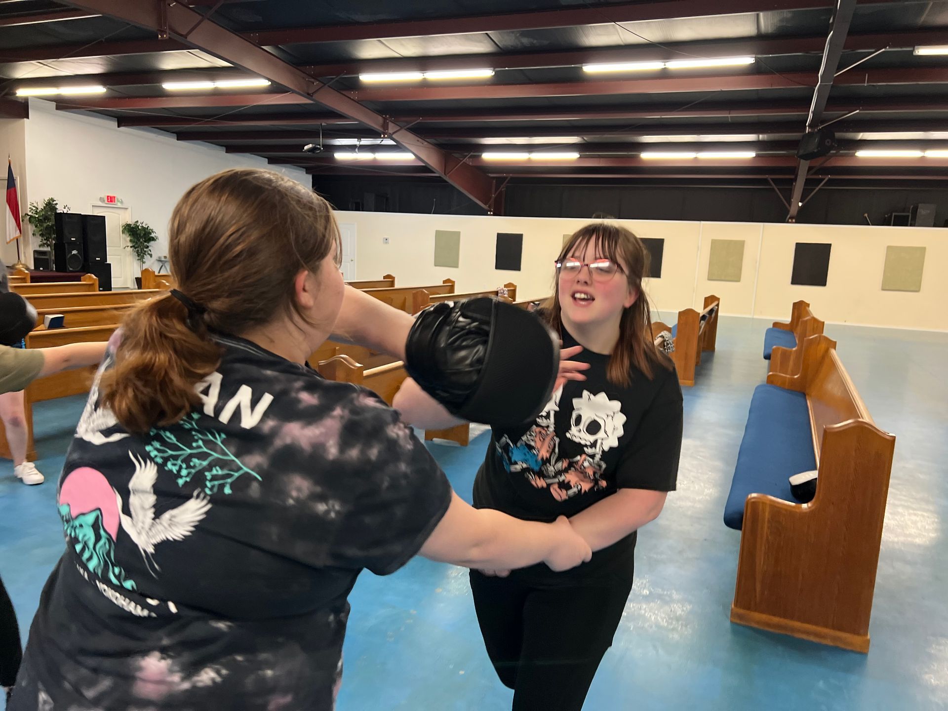Students practicing real-world Krav Maga defense techniques at Agoge Krav Maga in Lindale TX during 
