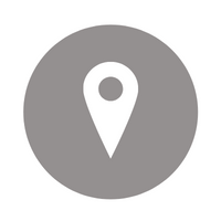 White location pin icon inside a gray circle on a white background