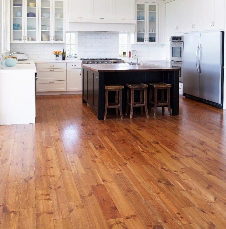 Empty kitchen with hardwood floors.