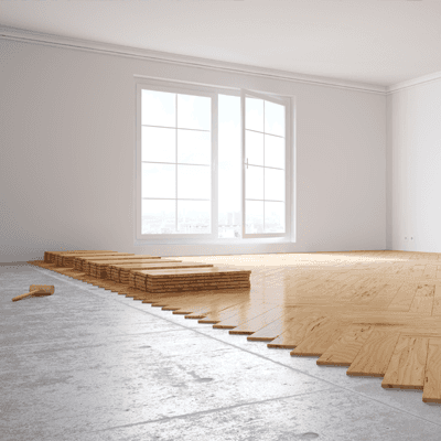 Hardwood floor being installed in a living room