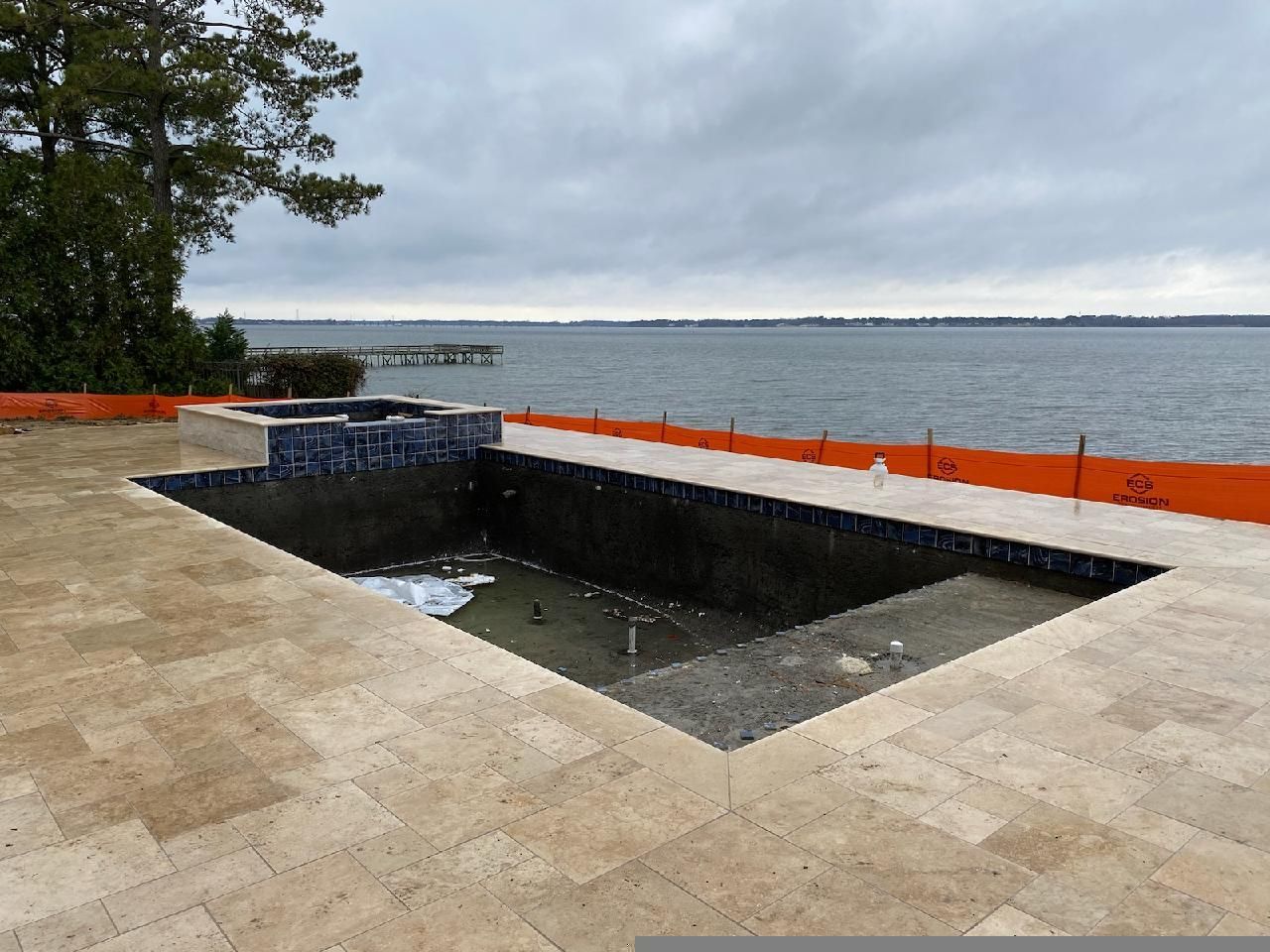 an empty swimming pool with a view of the ocean| Virginia Beach, VA | Atlantis Pools
