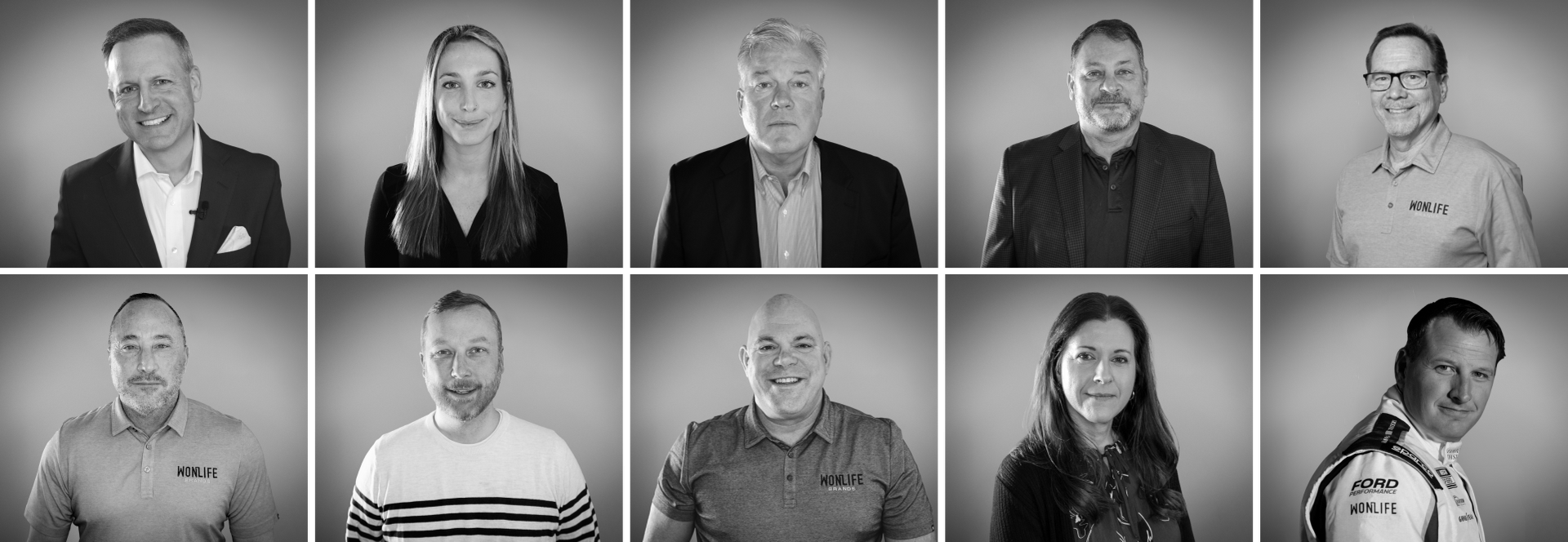 a group of people are posing for a black and white photo .