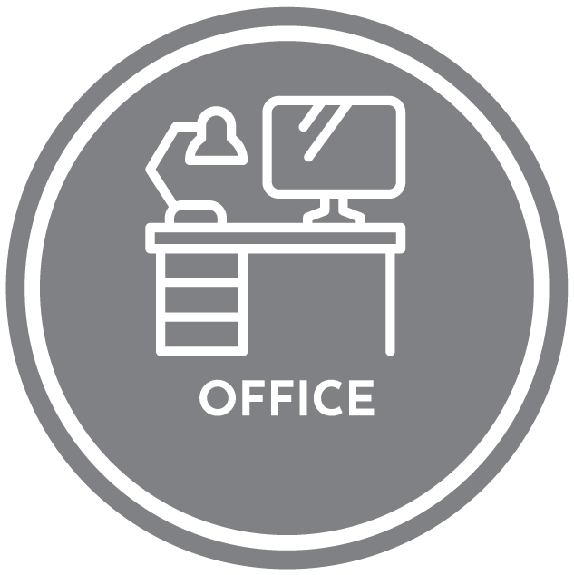An icon of a desk with a computer and a lamp in a circle.