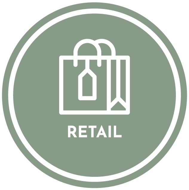 A green circle with a white icon of a shopping bag and the word retail on it.