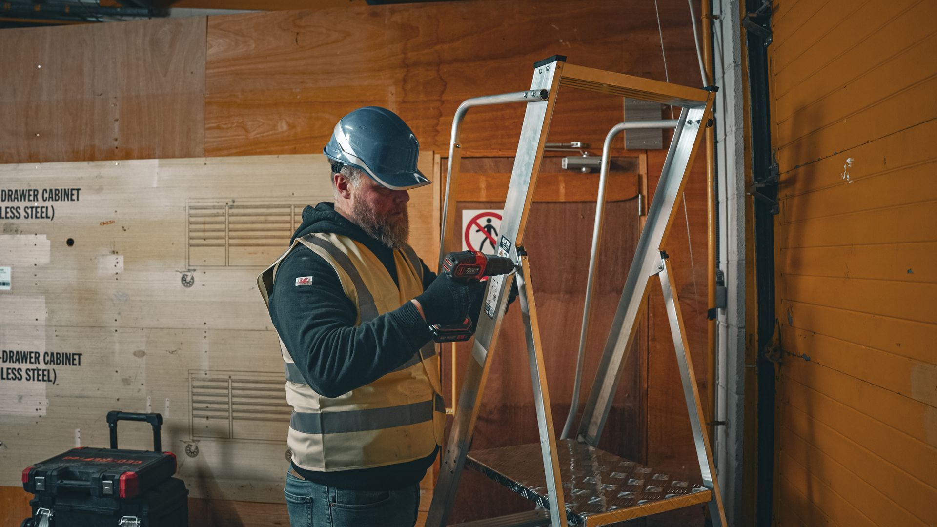 Engineer repairing a step ladder