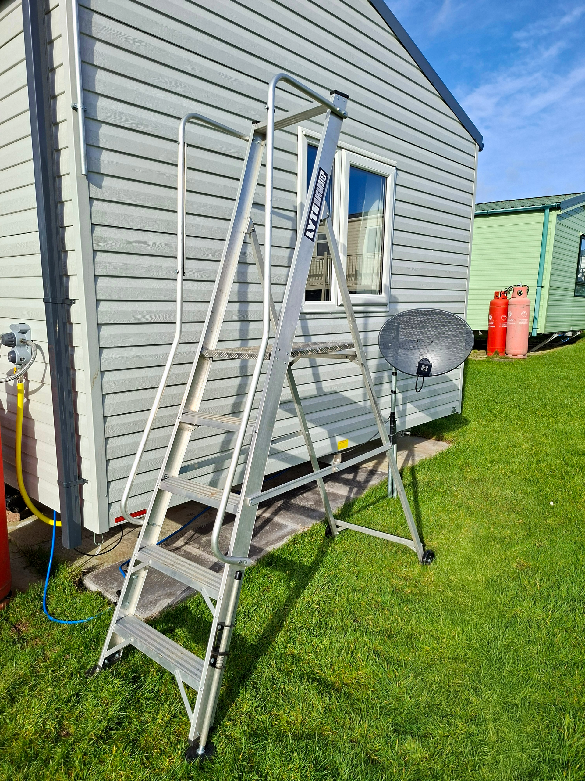 MagnaStep Wide Step Ladder outside a caravan