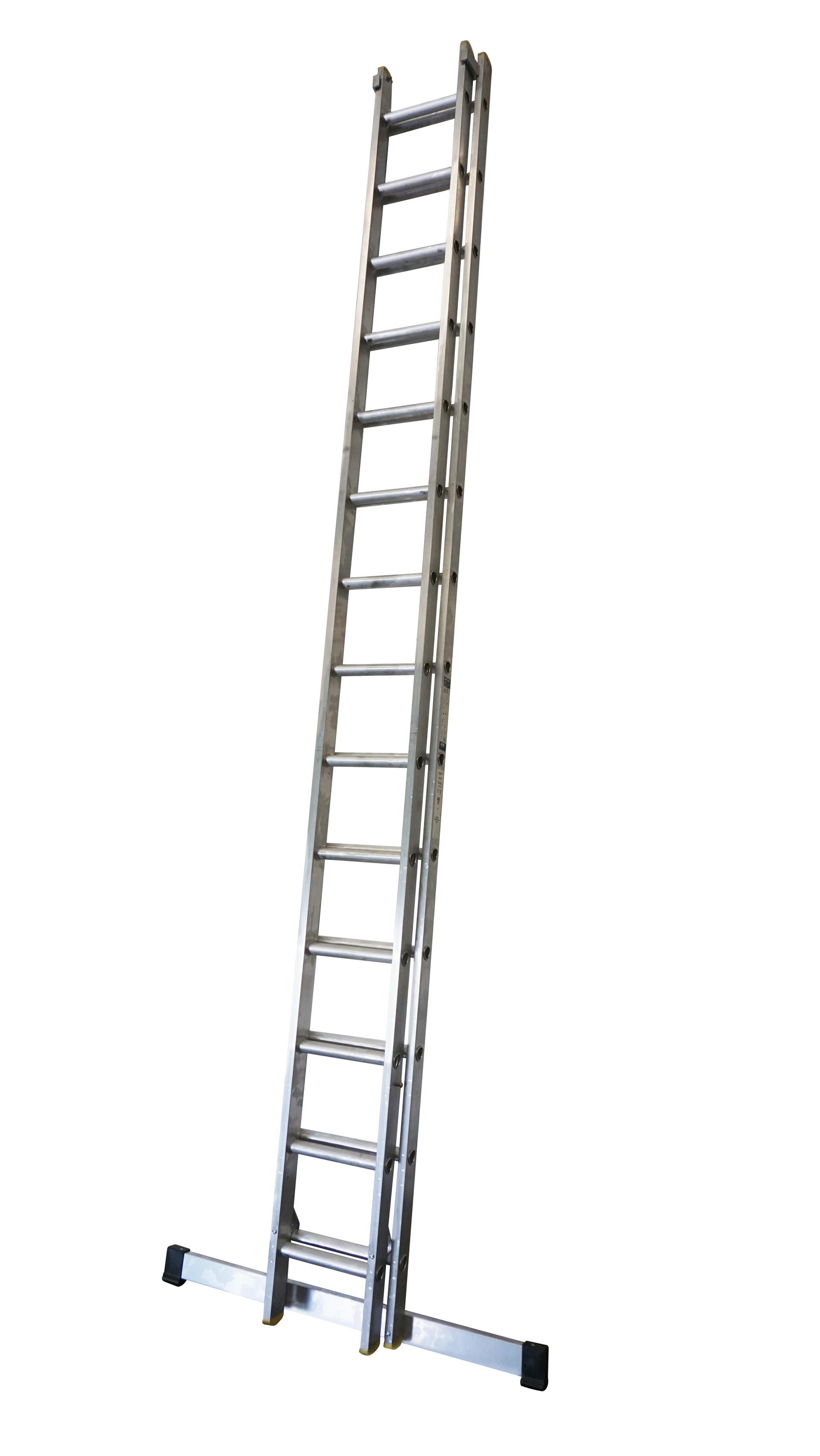 A long ladder is sitting on top of a white surface.